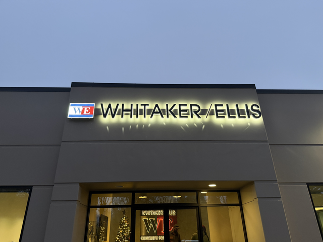 Halo lit letters, custom backlit sign on a storefront - quicksignage.com