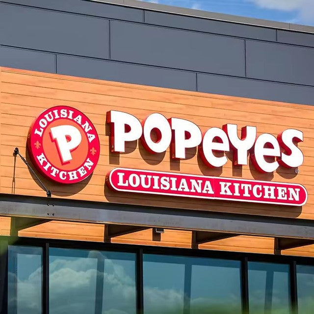 Illuminated channel letters, custom backlit sign on a building - quicksignage.com